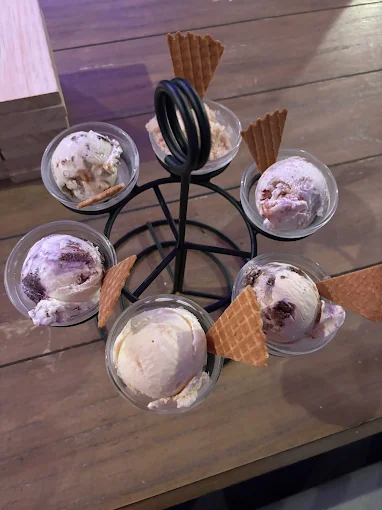 Berry-toned ice cream flight on a wire stand